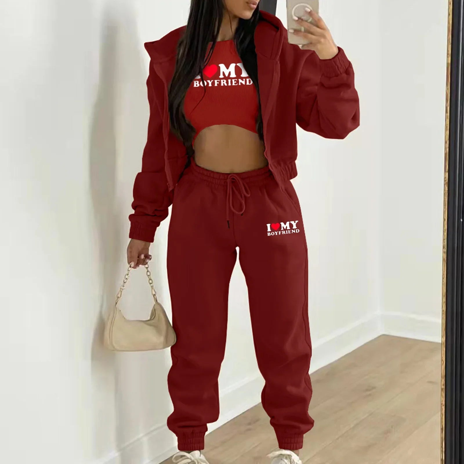 Burgundy plush knit sweater set with letter print, high waist joggers, and hooded jacket for lounging.