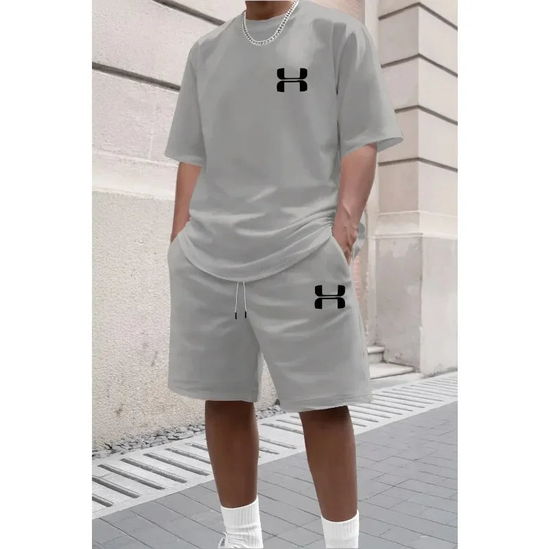 Light grey relaxed fit knit set with black logos for daily workouts.