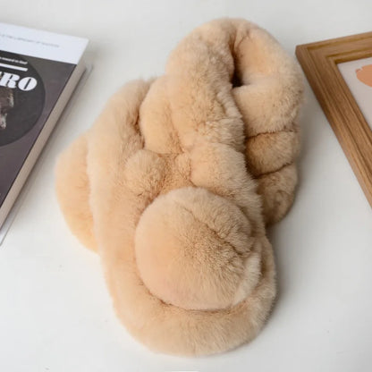 Beige faux fur short scarf with a thick triple-tube design and pom-pom detail.