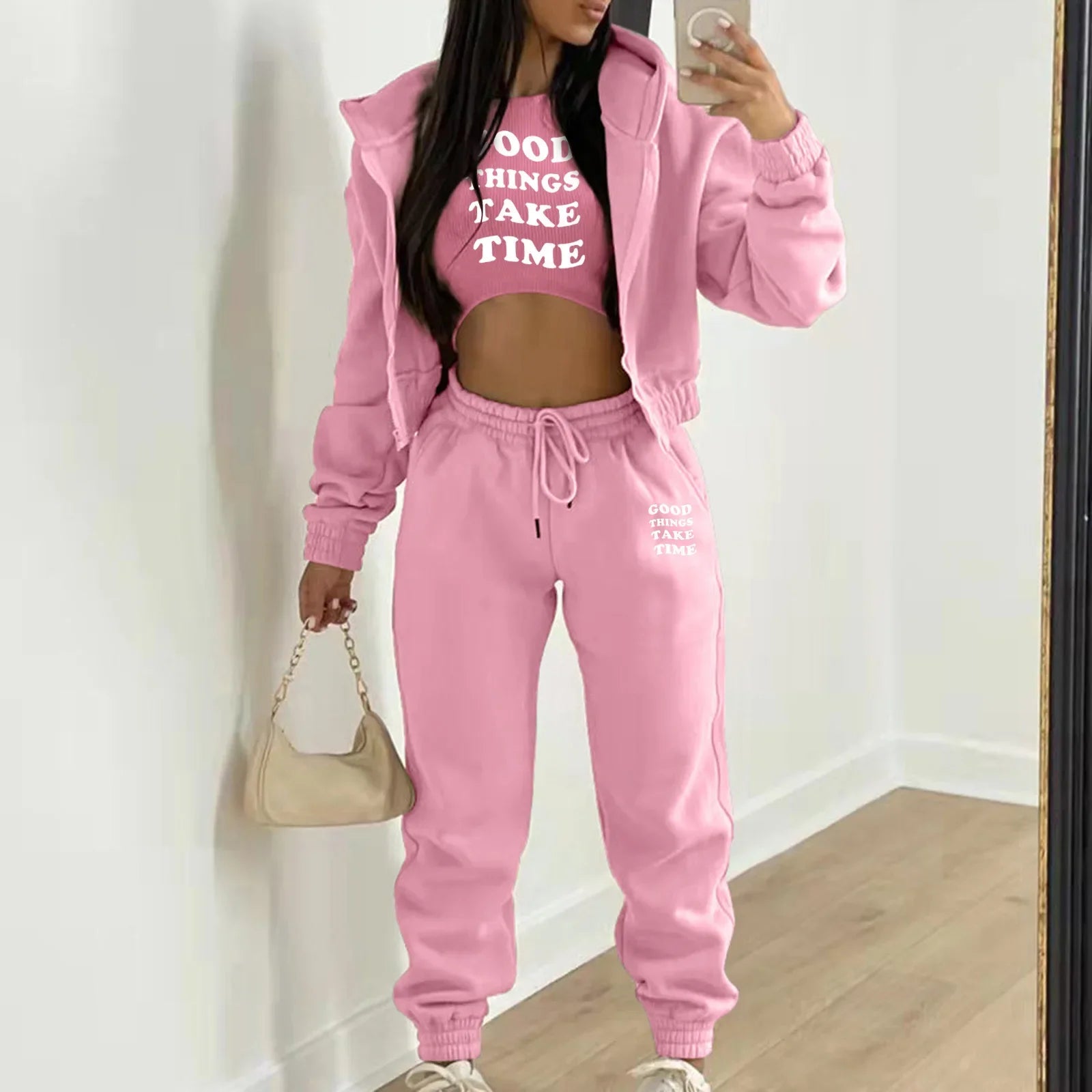 Pink hooded knit sweater set with white letter print, featuring a relaxed fit for cozy lounge wear.