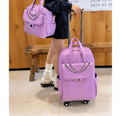 Light purple quilted rolling backpack with chain detail on the front pocket, plus a matching handbag.