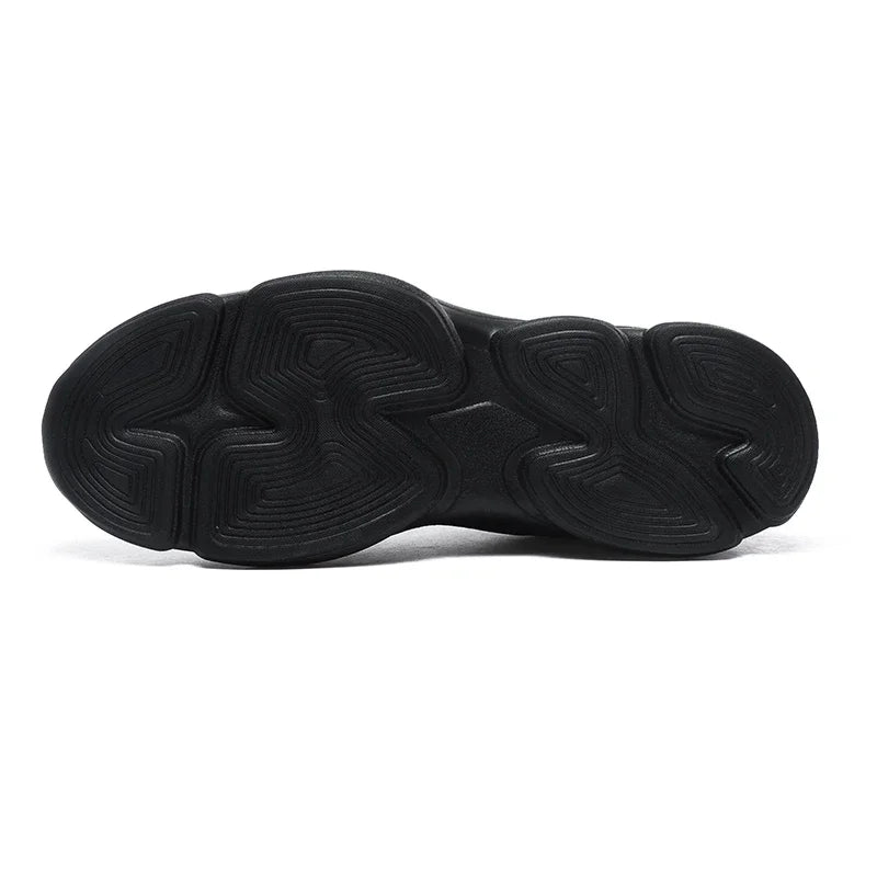 Black rubber non-slip sneaker sole with a wavy, textured traction pattern for daily walking.