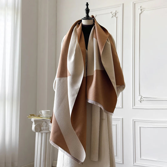 Tan and cream colour block knit shawl wrap with fringed edges for cold weather layering.