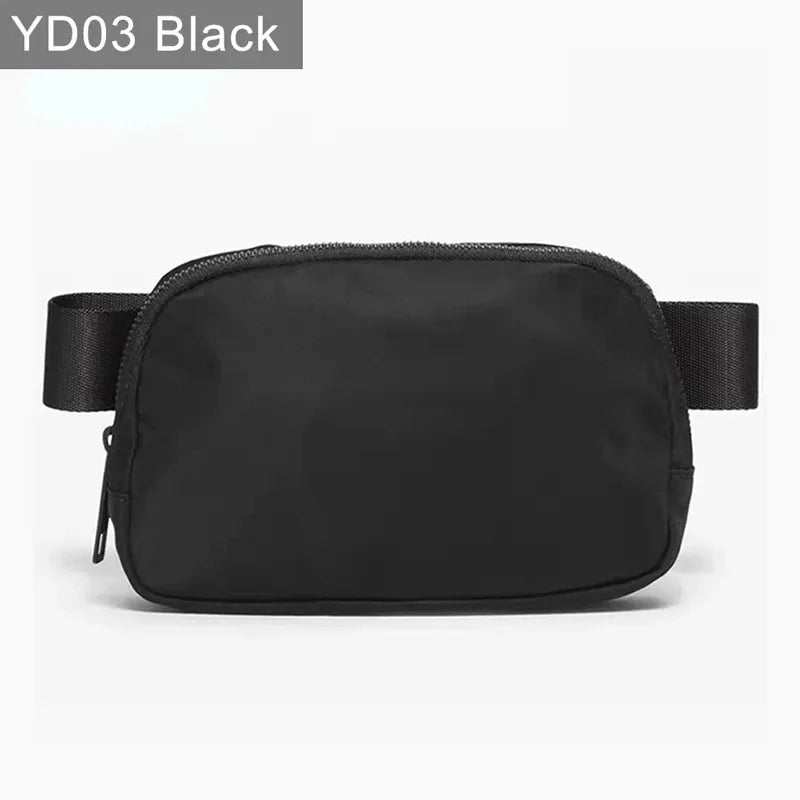Black waterproof crossbody with zip closure and adjustable strap for running and yoga.