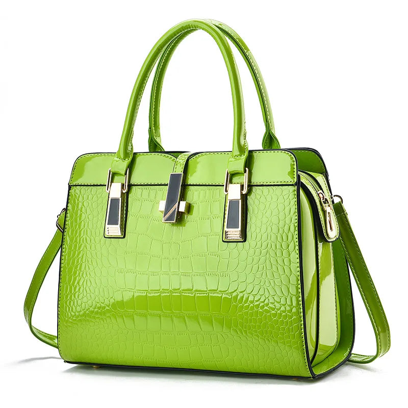 Bright green patent leather tote bag with crocodile embossed pattern, dual handles, gold hardware, and a center clasp.