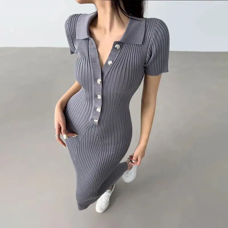 Grey ribbed knit mermaid dress with buttons, a collared neckline, and fitted silhouette for casual resort wear.