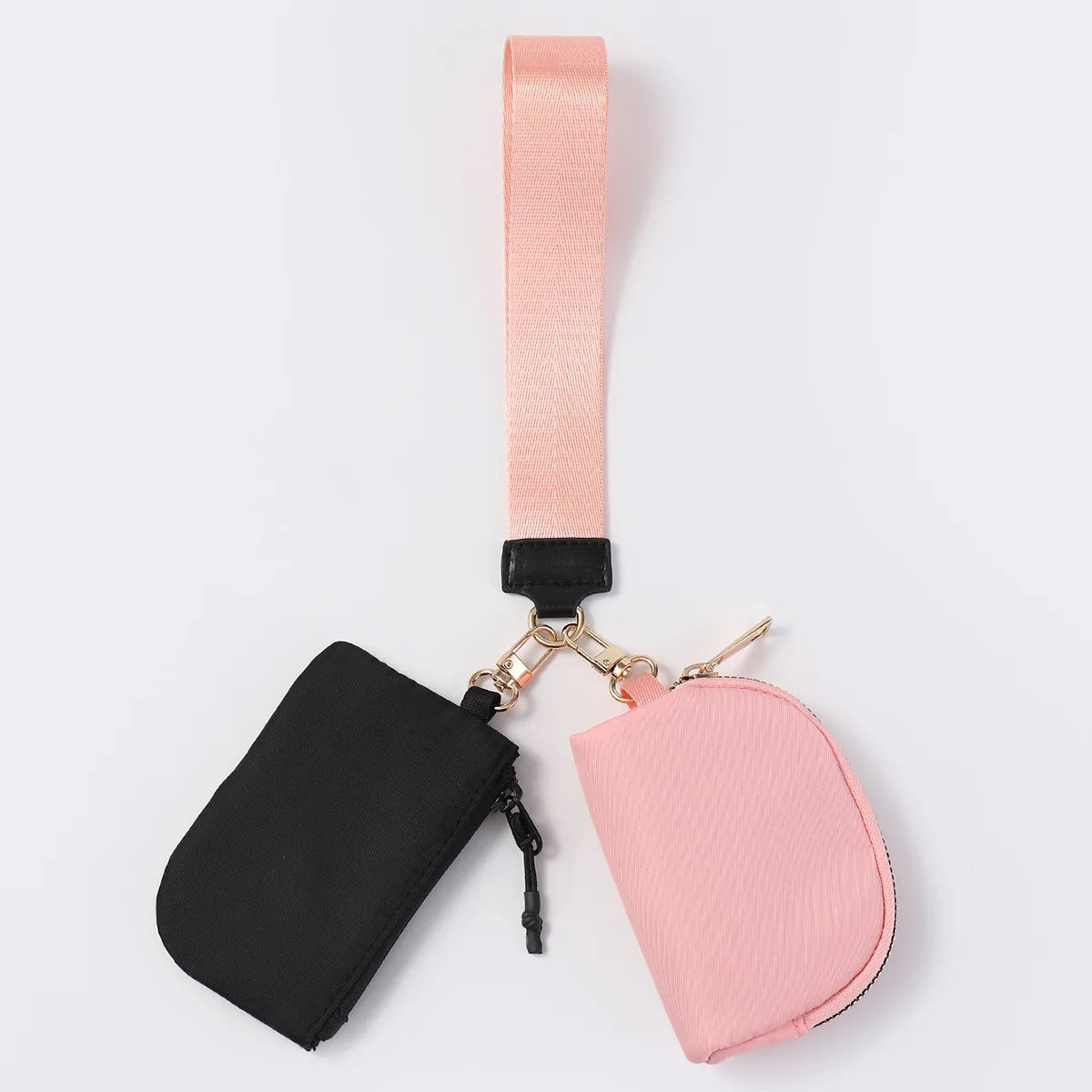 Black and pink nylon zip closure wristlet wallet with two pouches for daily errands.