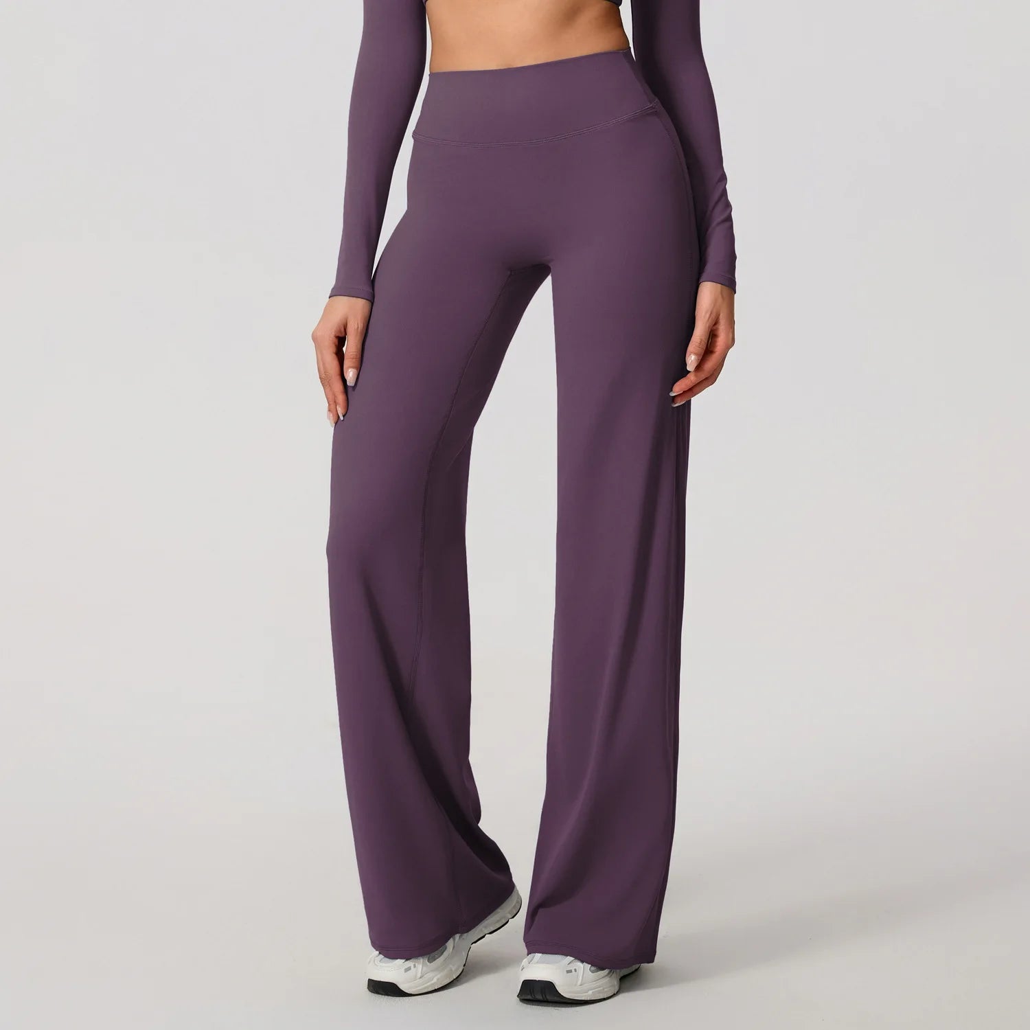 Dark purple high waist sculpting leggings with a stretchy knit fabric for yoga.