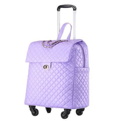Purple quilted PU rolling suitcase with a front flap, gold turn-lock, chain detail, and a telescoping handle.