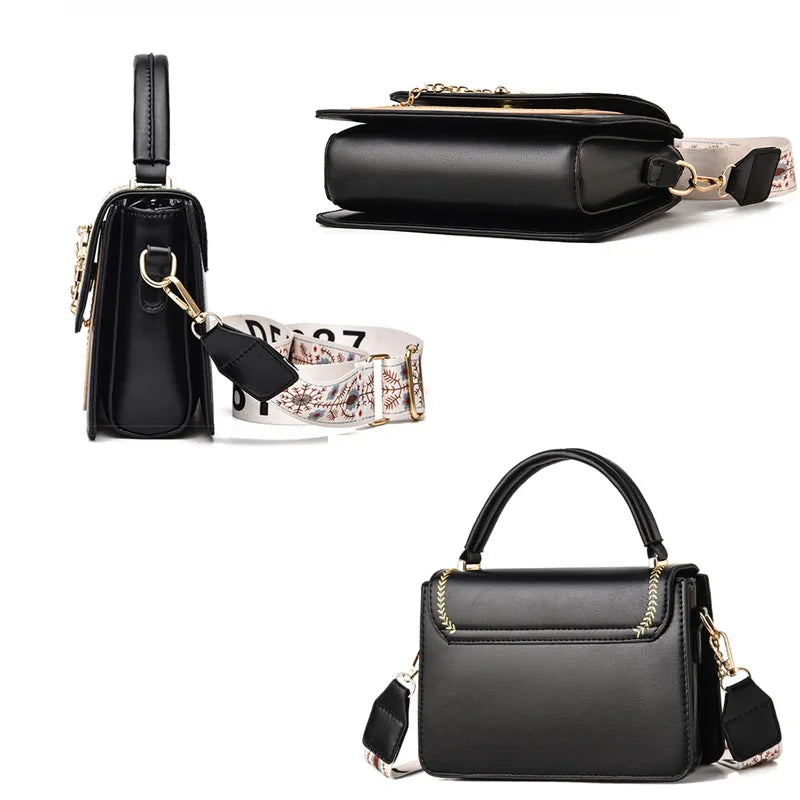 Black leather shoulder bag with top handle and patterned strap with gold-tone hardware.
