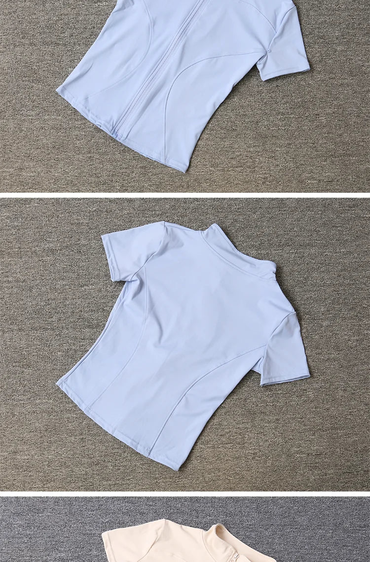 Light blue sculpting training top with a front zip, stand collar, and fitted design for yoga and gym workouts.