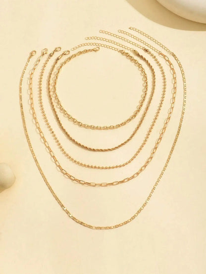 Women's Goldtone Necklace Set With Braided Bead Chains And Star Pendants In Five-Length Array