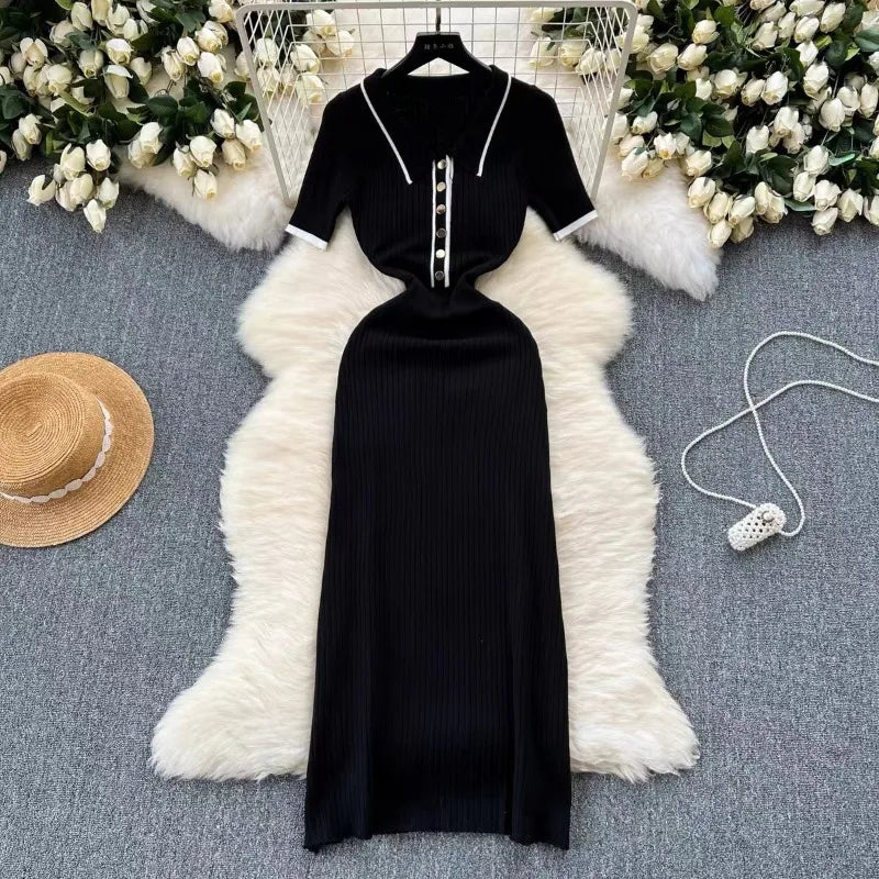 Black ribbed knit dress with white patchwork polo collar and buttons, a fitted silhouette for casual day wear.