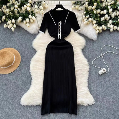 Black ribbed knit dress with white patchwork polo collar and buttons, a fitted silhouette for casual day wear.
