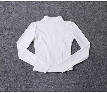 White long-sleeve polyester sport jacket with a fitted design and thumbholes for yoga training.
