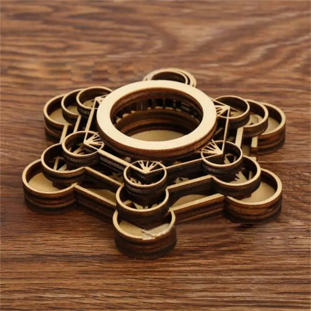 Brown wooden crystal ball holder with geometric lotus pattern and layered circular base.