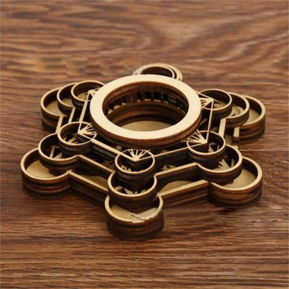 Brown wooden crystal ball holder with geometric lotus pattern and layered circular base.