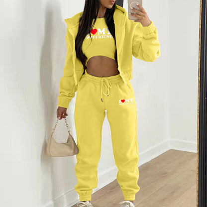 Yellow knit hoodie and pants set with graphic letter print for lounging.