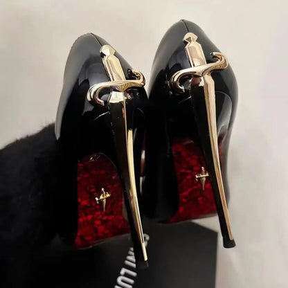 Black PU stiletto pumps with gold sword-shaped heels and red textured soles for evening wear.