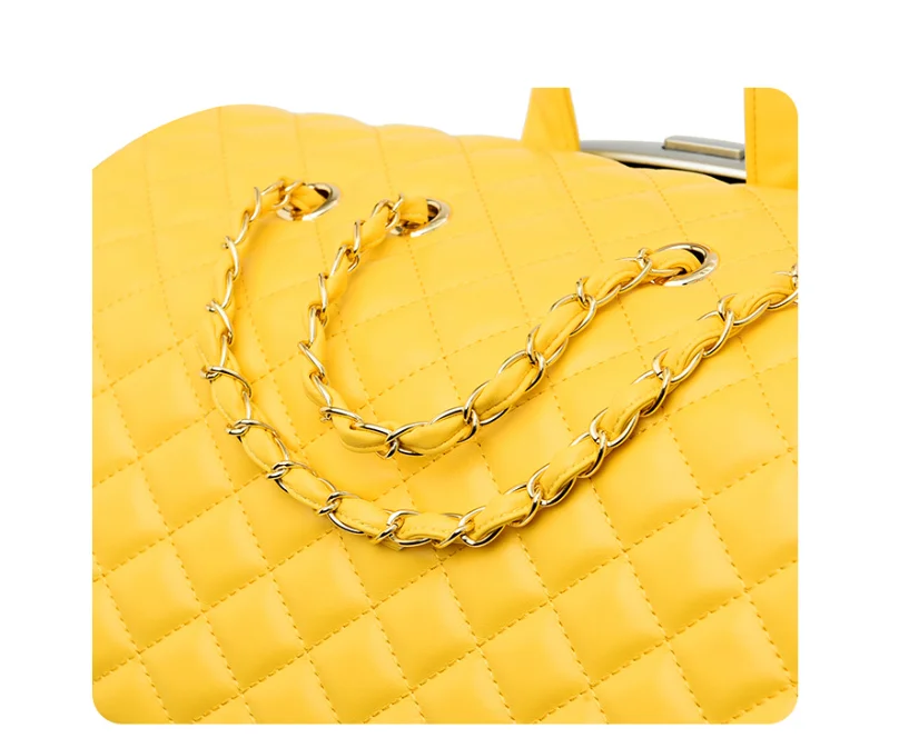 Yellow quilted travel bag with gold chain straps interwoven with leather.