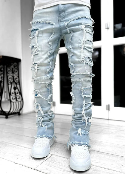 Light blue denim fitted jeans with heavy frayed distressed detailing for a casual street style look.