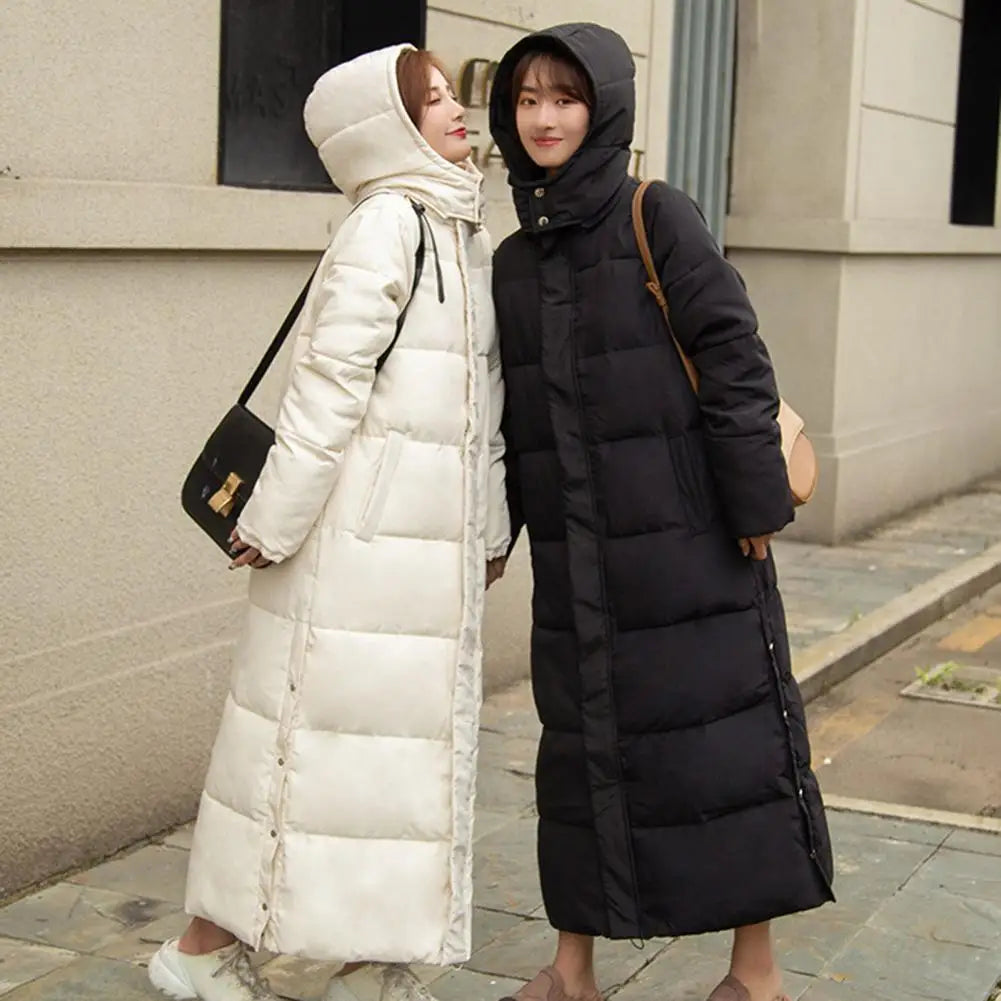 Women's long hooded coat with zip closure and side slits