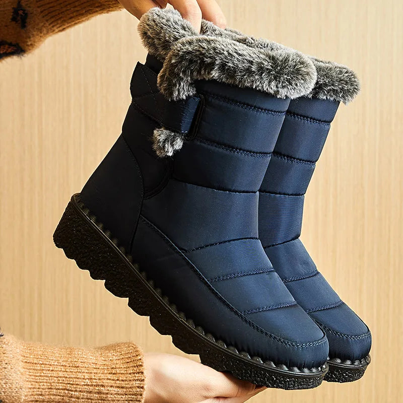 Navy blue nylon snow boots with faux fur trim and black rubber soles.
