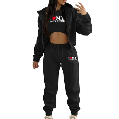 Black knit sweater set with white letter print, relaxed fit, drawstring joggers, and hoodie for casual lounge wear.