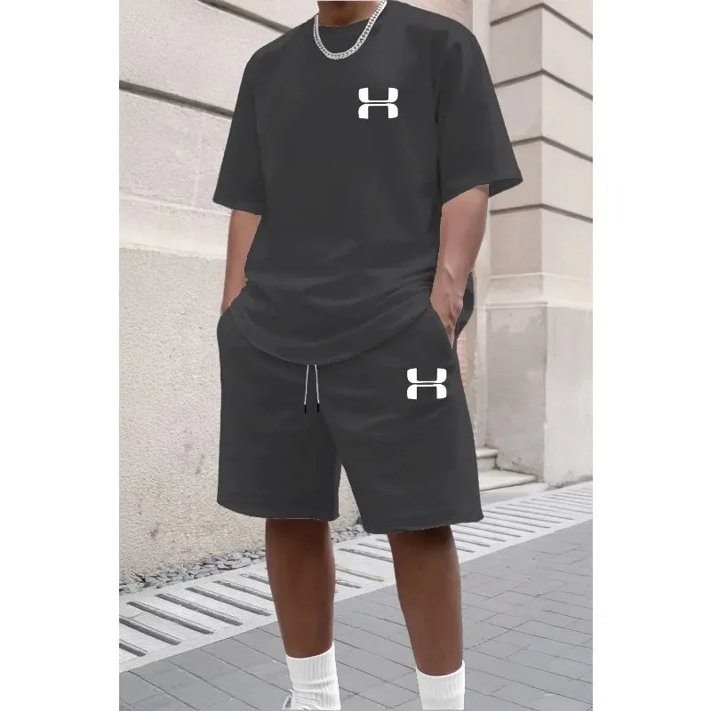 Black relaxed knit set with short sleeve tee and shorts, worn for athletic training.