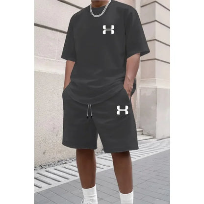 Black relaxed knit set with short sleeve tee and shorts, worn for athletic training.
