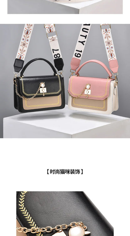Two leather shoulder bags with wide patterned straps, gold chain details, and pearl-accented clasps. One is black, the other pink.