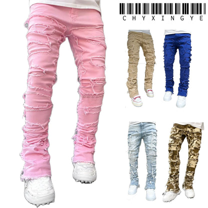Pink, blue, and camo distressed patchwork jeans with frayed tassel details for a fitted casual look.