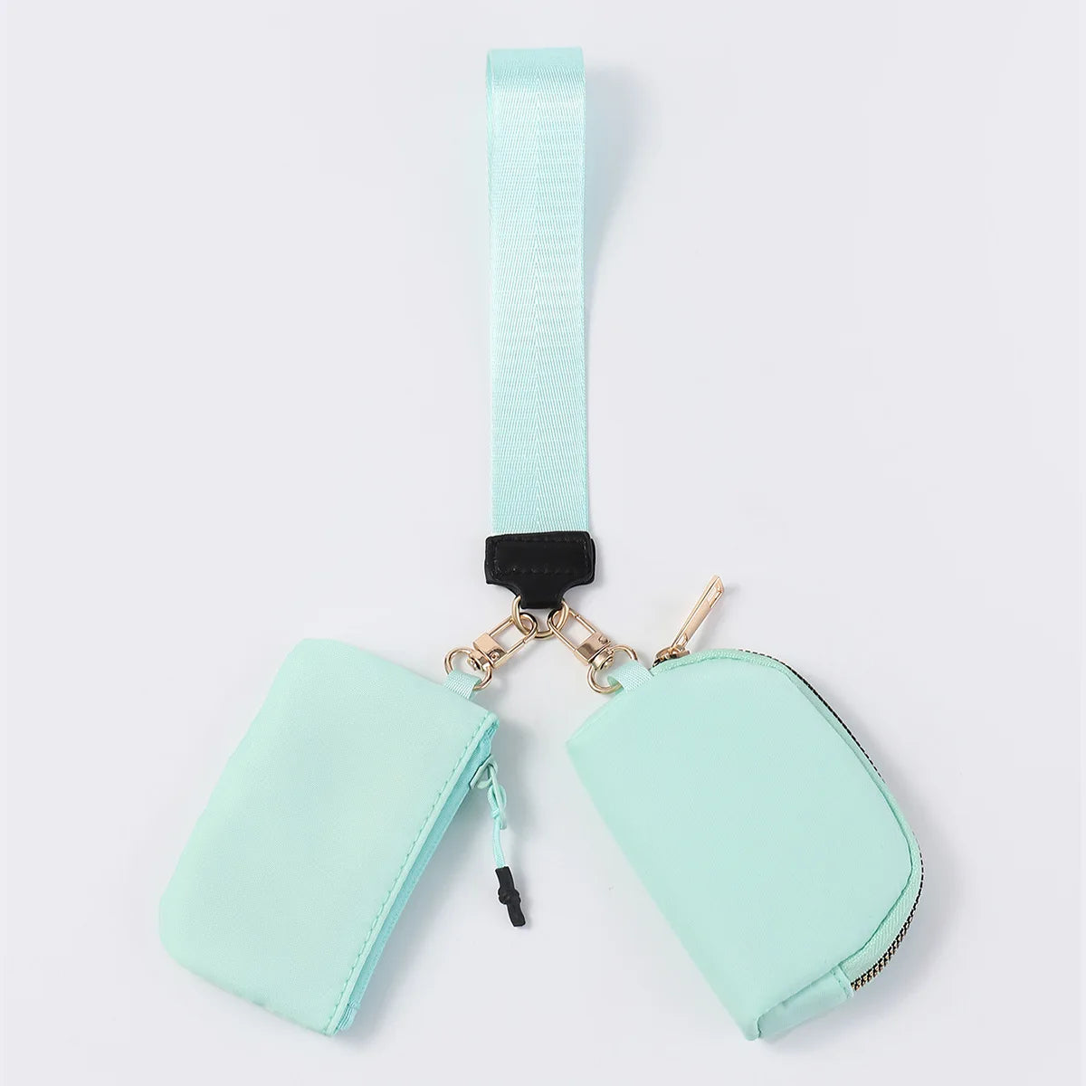 Mint nylon dual pouch wristlet wallet with zip closure and wrist strap for organizing cards and keys.