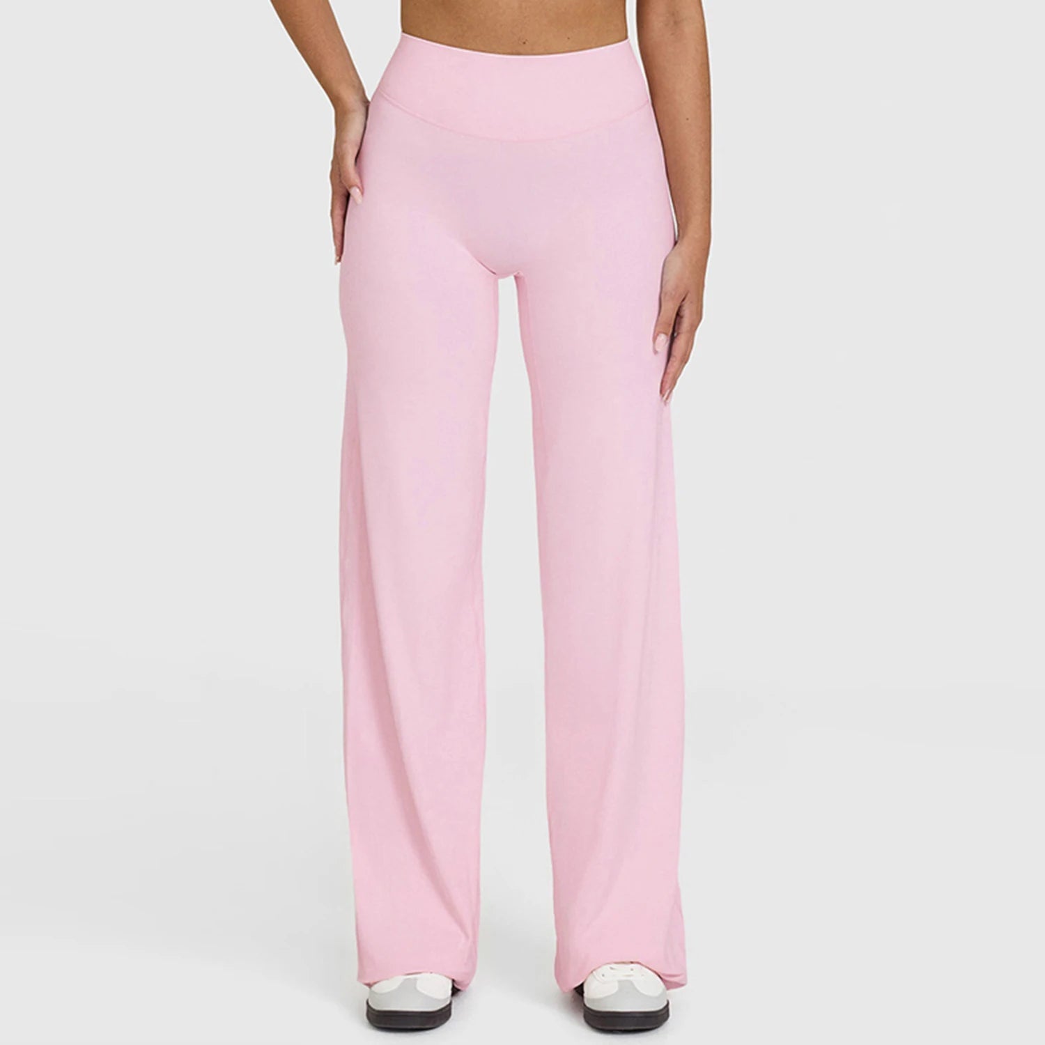 Light pink high waist stretchy leggings in a knit fabric for yoga and active exercise.