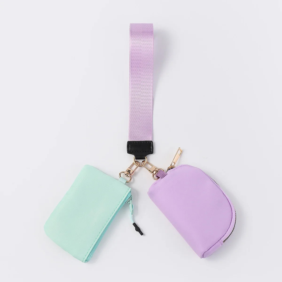 Mint and purple nylon dual pouch with zip closure and adjustable strap for carrying cards, coins, and keys.