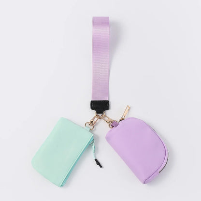 Mint and purple nylon dual pouch with zip closure and adjustable strap for carrying cards, coins, and keys.
