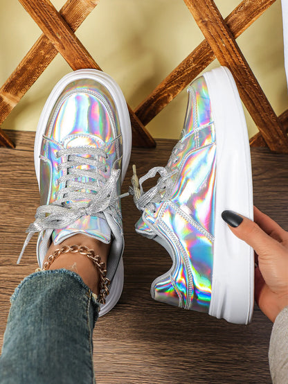 Silver holographic casual sneakers with thick white soles and sparkly laces.