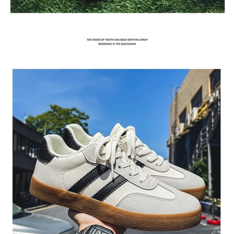 Off-white canvas sneakers with black side stripes and brown gum soles, a breathable casual training shoe for daily wear.