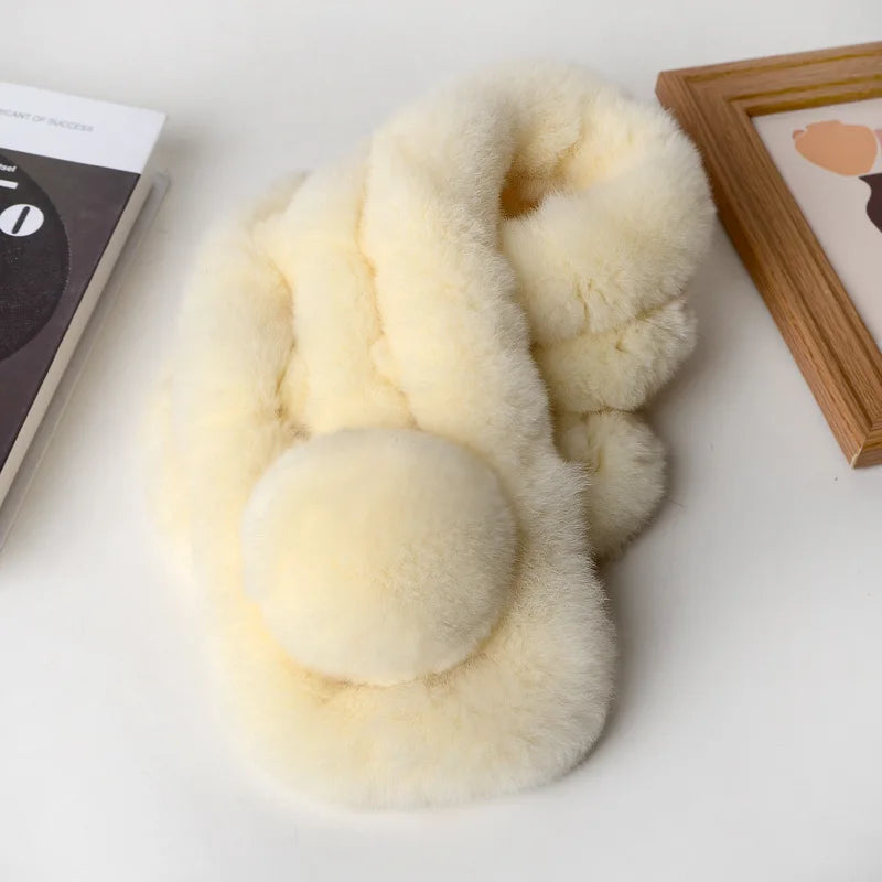 Cream faux fur scarf with a triple-tube style and pom-pom detail.