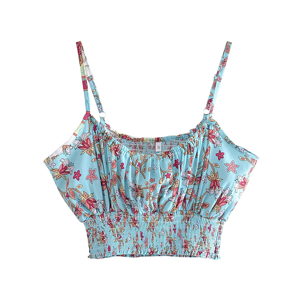 Blue floral print crop top with thin straps and a stretchy smocked hem for a flowy clothing set outfit.