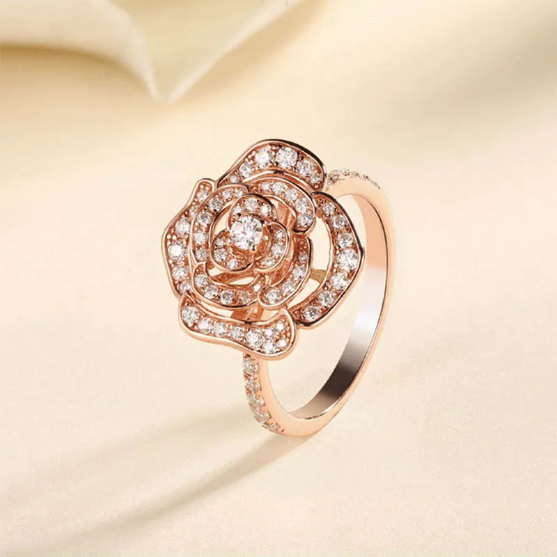 Rose gold-plated 925 silver ring featuring a paved moissanite flower design.