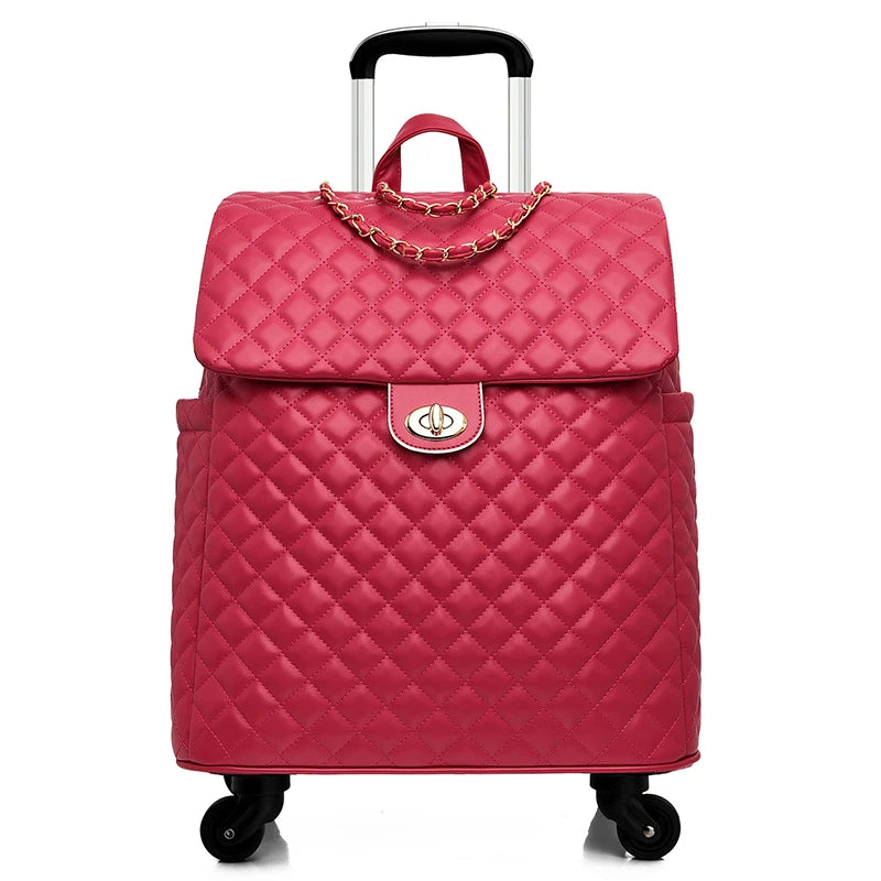 Pink quilted PU leather rolling luggage with gold chain detail, twist-lock closure, and a retractable handle.