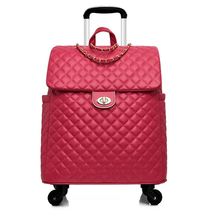 Pink quilted PU leather rolling luggage with gold chain detail, twist-lock closure, and a retractable handle.