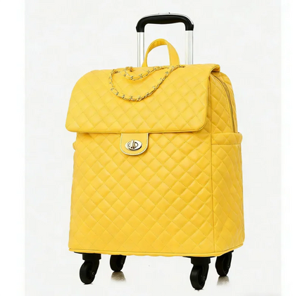 Yellow quilted leather rolling travel bag with flap, gold chain detail, turn-lock closure, and a telescoping handle.