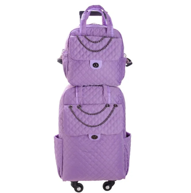 Purple quilted nylon rolling luggage set with chain accents and twist-lock front pocket closures.
