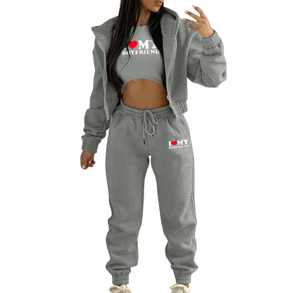 Gray knit sweater set with hood and letter print. Relaxed fit for lounging.