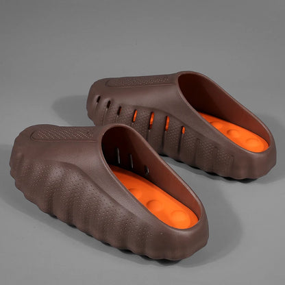 Brown and orange cushioned platform sandals with perforated design for casual everyday wear.