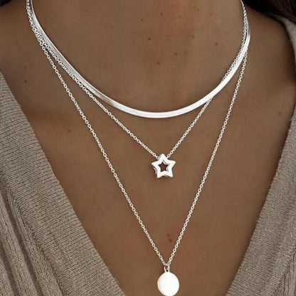 Women's gold-tone layered chain necklace with pendant detail