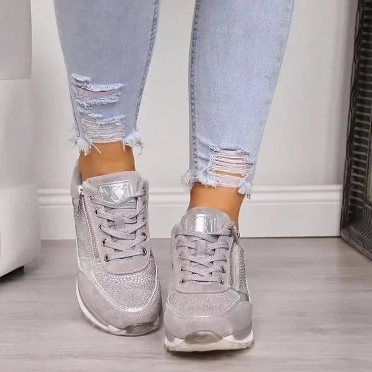 Grey PU wedge sneakers with side zip, breathable fabric, and cushioned soles for casual everyday wear.