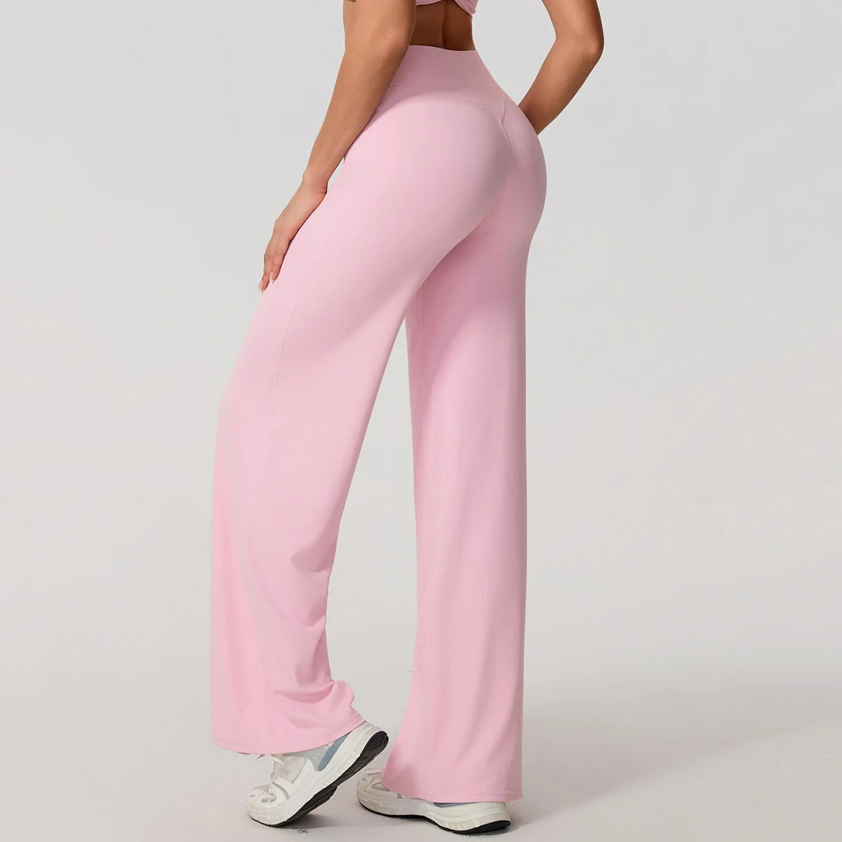 Light pink high waist sculpting leggings in a stretchy knit for exercise.
